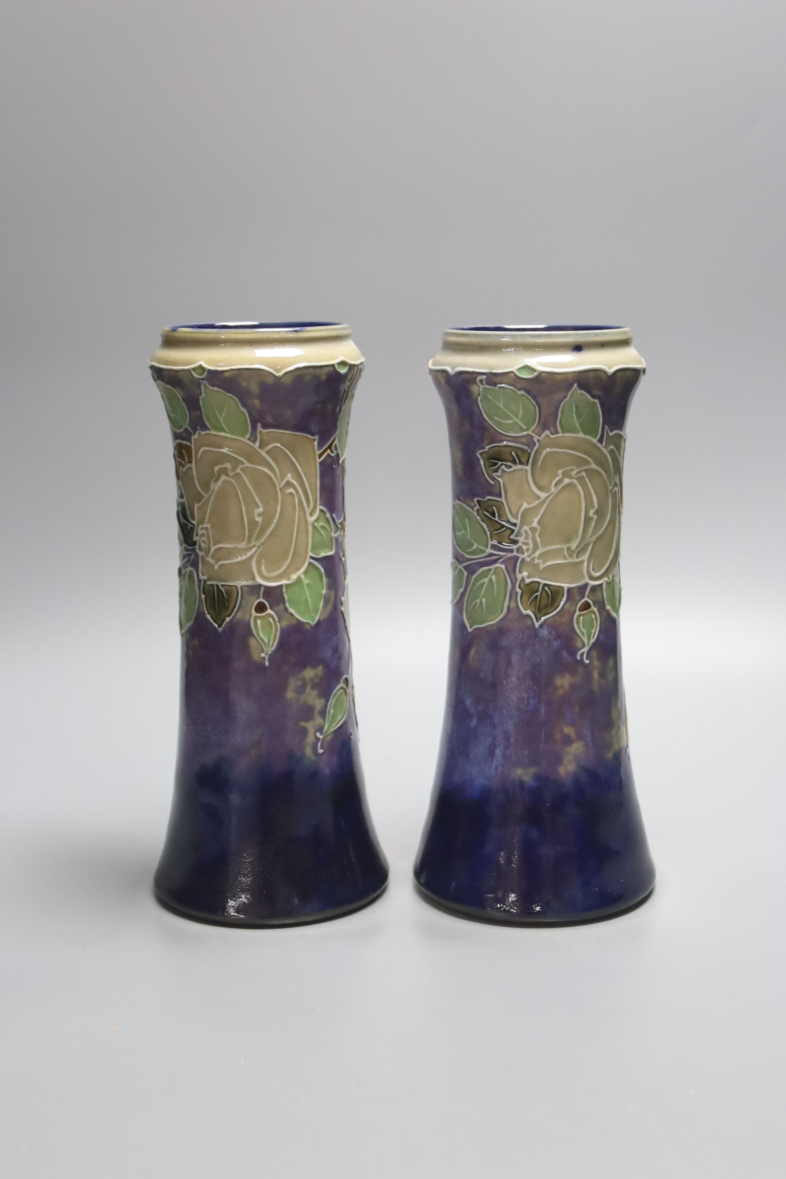 A pair of Doulton stoneware vases, height 26.5cm